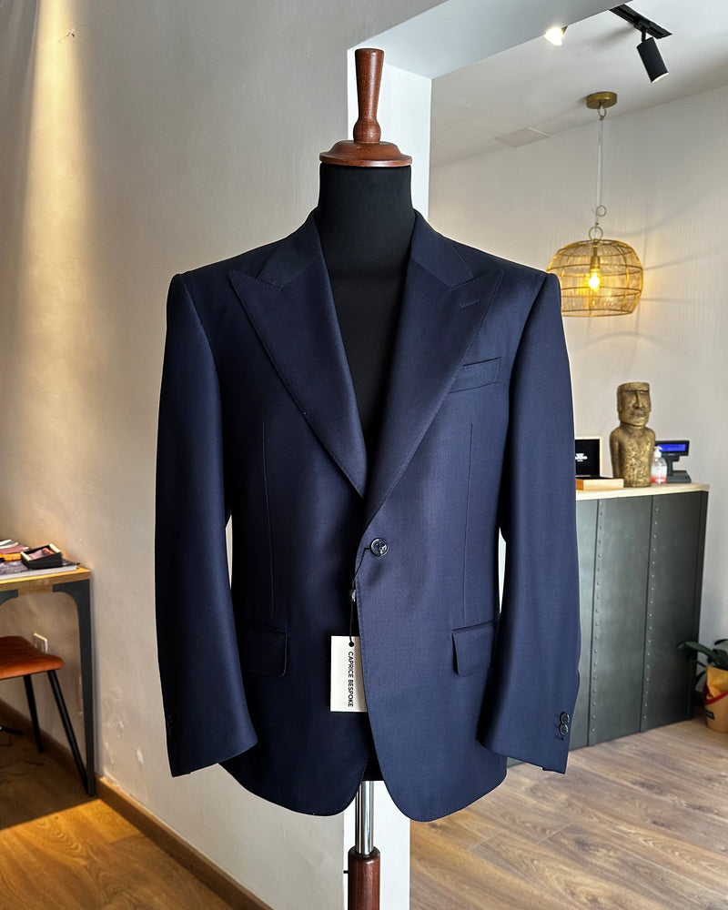 navy-blue-tailored-jacket-made-with-loro-piana-fabric-on-mannequin-in-italian-atelier