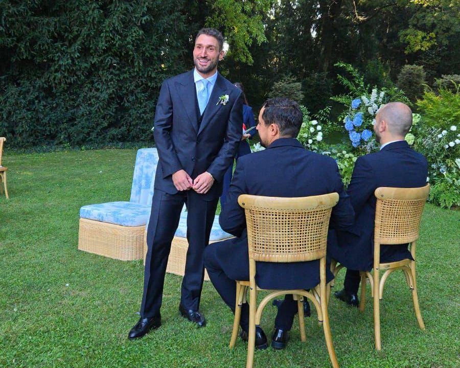 groom-in-a-tailored-suit-by-caprice-bespoke-standing-next-to-his-best-men