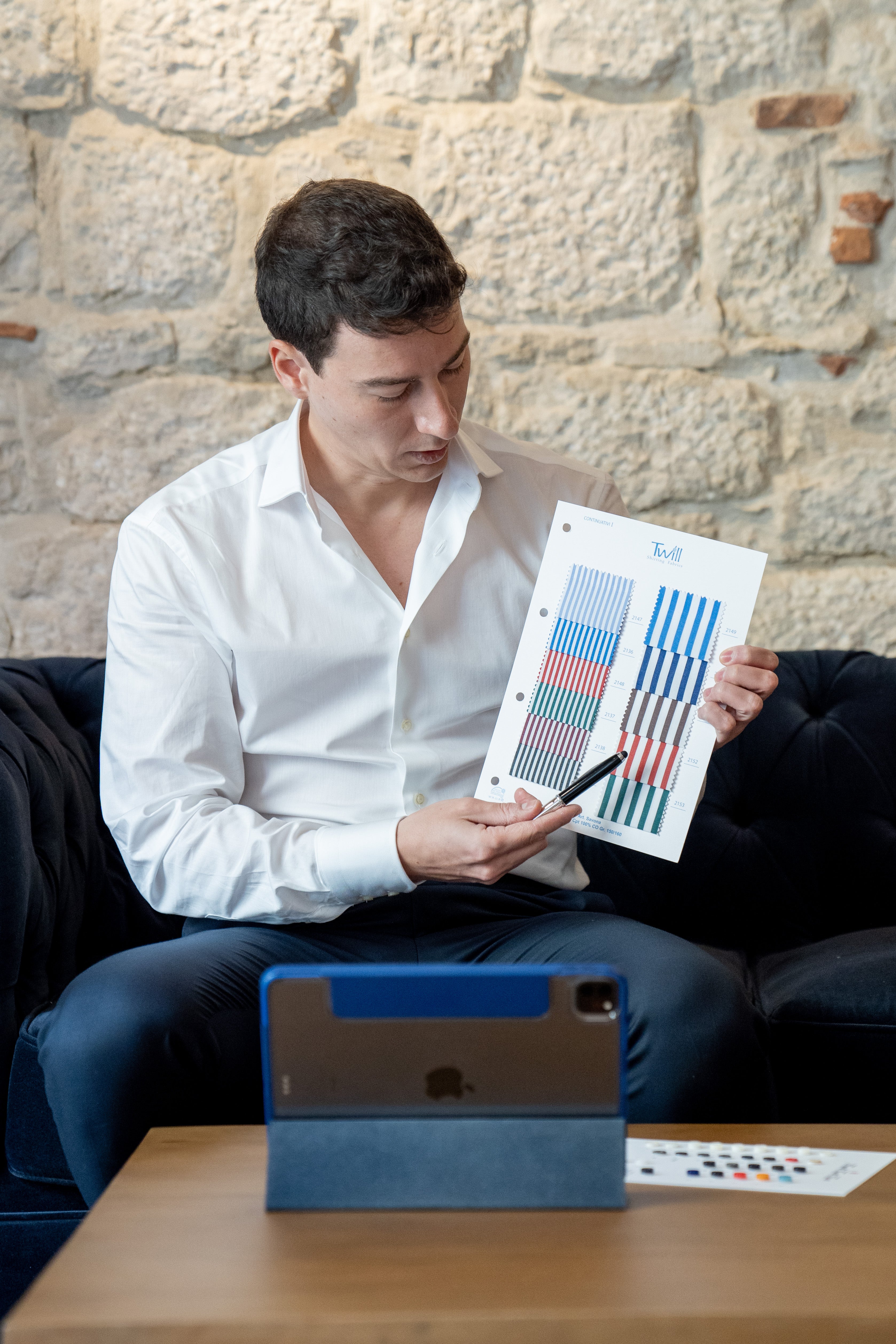 personal-stylist-holding-shirt-fabric-samples-and-advising-customers-via-videconference